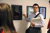 Ryan Griffin, junior digital media studies major, presents his poster during Graphic Design II. - Photo by Kristi McMurry