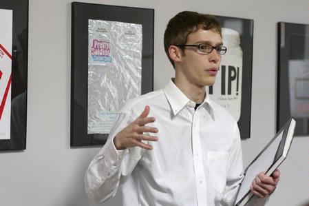 A.J. Shelby, sophomore digital media studies major, presents his poster for the student film "The Storm" during his Graphic Design II class.