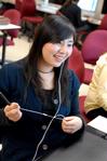 Shinae Giffin, sophomore art major, works on a poster in the digital media studies lab. - Photo by Kristi McMurry