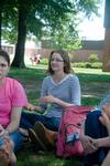 Under the shade, Elizabeth Waibel, junior journalism major, discusses the Christian elements of a film with her classmates during her History of Christianity and Pop Culture class with Dr. Keith Bates, Assistant Professor of History.  - Photo by Beth Spain