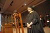 Mary Ann Poe, professor of social work and BSW program director, stands on stage during Awards Day chapel and prepares to hand over her Faculty of the Year title. Poe was Faculty of the Year for the 2009-2010 academic year. - Photo by Morris Abernathy