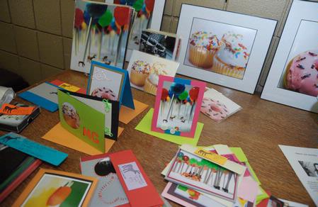 Kristi McMurry, senior digital media studies major, displays her photography and greeting cards at the Mother's Day Pottery and Art Sale. 