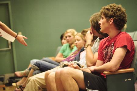 Cameron Puckett, sophomore media communications major, and fellow students listen to notes from their director in preparation for the theatre's student directed one acts.