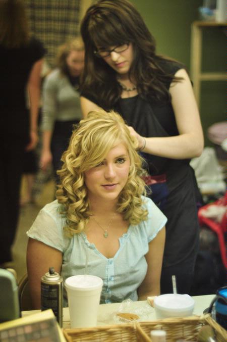 Cassie Osborn, freshman social work major, and Abigail Ebensberger, freshman Christian studies major, prepare back stage before the student one act plays.