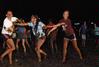 Students gather behind the Heritage Complexes to celebrate the end of a semester by playing in the mud at Midnight Mudness sponsored by Young Alums. - Photo by Abigail Harris