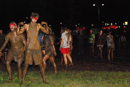 Sam Ritter, sophomore music major, poses covered in mud at the Midnight Mudness event sponsored by Young Alums. Students gathered behind the Heritage Complexes to celebrate the end of a semester by playing in the mud.