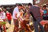 Students gather on the lawn of the Heritage complex to see a visiting baby kangaroo. - Photo by Abigail Harris