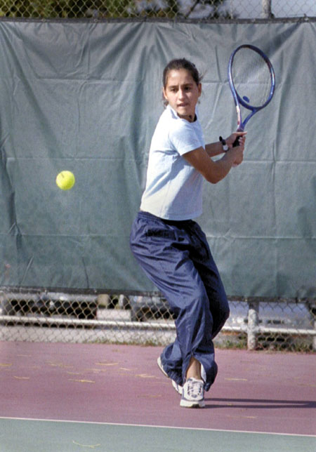 Paula Coutinho returns a shot during practice.