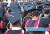 Graduates bow in prayer and thanksgiving at the spring 2010 commencement ceremony. - Photo by Abigail Harris