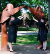 Ashley Nabors, nursing major and Sarah Stinson, English major pose by Union art before they participate in the spring 2010 graduation ceremony. 
 - Photo by Ebbie Davis