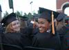 Nursing graduates Elizabeth Matlock and Raquel Mack share excitement with friends at the spring 2010 commencement ceremony. 
 - Photo by Beth Spain