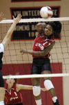 Junior Gladys Wandera goes for the kill in a match versus Christian Brothers.  Union won 3-0. - Photo by Jim Veneman