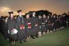 Class of 2010 graduates stand to conclude the commencement ceremony.  - Photo by Beth Spain