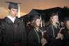 Graduates in the class of 2010 pray as they conclude the spring commencement ceremony. - Photo by Beth Spain