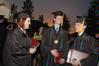 Kaitie Johnson and Bradley Kiddie congratulate Matthew Kuchem, who was awarded the Tigrett Medal at the spring 2010 graduation ceremony. - Photo by Beth Spain