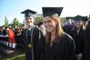 Courtney Bragg happily anticipates graduating along with classmates Noah Arnold and Blair Hoglen at the 2010 commencement ceremony.  - Photo by Morris Abernathy