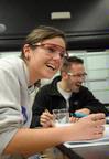 Students enjoy some laughter while taking notes after a chemistry lab experiment.  - Photo by Morris Abernathy