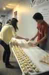 Physics students set out cupcakes with numbers that make up the value of Pi in celebration of Pi Day and Einstein's birthday. - Photo by Morris Abernathy