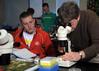 Dr. Mark Bolyard, professor of biology and department chair, helps a student with a biology lab experiment. - Photo by Morris Abernathy