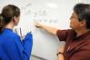 Dr. Troy Riggs, professor of mathematics, helps a student with a math problem. - Photo by Morris Abernathy