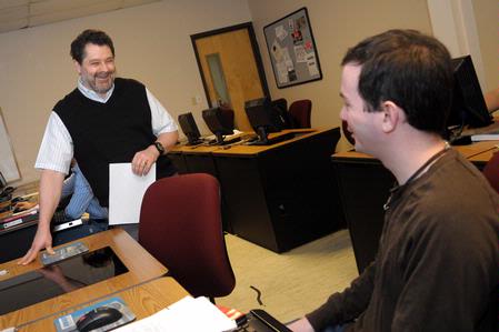 Dr. Jan Wilms, professor of computer science and department chair, talks to a student about an assignment.