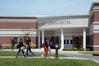 Students walk past the Carl Grant Events Center. - Photo by Morris Abernathy