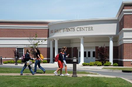 Students walk past the Carl Grant Events Center.