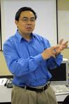 Dr. Max Haifei Li, associate professor of computer science, teaches a class.  - Photo by Morris Abernathy