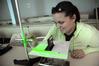 Kristina Borza, senior sports medicine major, works on a physics lab assignment. - Photo by Morris Abernathy