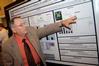 Dr. Charles Baldwin, O.P. and Evalyn Hammons University Professor of Pre-Medical Studies, asks a question about one of the chemistry projects presented at the annual scholarship symposium.  - Photo by Morris Abernathy