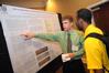 Students present their semester long projects at the annual scholarship symposium. - Photo by Morris Abernathy