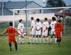 Fabio Buarque (12) attempts a free kick over a wall of defenders.  Kekec Zivkovic (10) looks on. - Photo by Uncredited