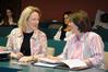 Dr. Jeannette Russ and Mary Ann Poe share a laugh as they wait for the presentations to begin at the annual scholarship symposium. - Photo by Morris Abernathy