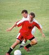Christopher Printice (18) displays great footwork as he keeps the ball from a defender. - Photo by Uncredited