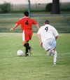 Redzi Stojiljkovic (4-Red) wins the ball and advances toward the goal. - Photo by Uncredited