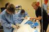 Nursing students work on simulations in Providence Hall with Molly Wright, assistant professor of nursing. - Photo by Morris Abernathy