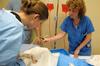 Nursing students work on simulations in Providence Hall. - Photo by Morris Abernathy