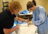 Nursing students work on simulations in Providence Hall with Molly Wright, assistant professor of nursing. - Photo by Morris Abernathy