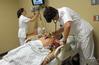 Nursing students work on simulations in Providence Hall. - Photo by Morris Abernathy
