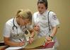 Nursing students work on simulations in Providence Hall. - Photo by Morris Abernathy