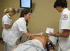 Nursing students work on simulations in Providence Hall. - Photo by Morris Abernathy
