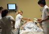 Nursing students work on simulations in Providence Hall. - Photo by Morris Abernathy