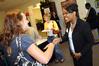 Renee Jones, assistant director of recruitment & information technology, career services, student services, shakes hands with visitors at the Career Services Open House.  - Photo by Morris Abernathy
