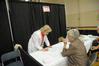 Sheila Mitchell, dean of the School of Pharmacy, works at the health fair that was part of the Senior Adult Extravaganza. - Photo by Morris Abernathy