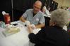 Nurse Paul Mayer, director of health services, student services, works at the health fair as part of the Senior Adult Extravaganza. - Photo by Morris Abernathy
