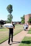 Greg Thornbury, dean of the School of Theology & Missions, helps new students move their things into the dorms on Move In Day. - Photo by Victoria Stargel
