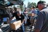 Steve Monroe, father of new student Chesney Monroe, unloads a box for someone to carry to Chesney's dorm room. Faculty, staff, and returning students joined forces on Move In Day to help new students get moved in quickly and efficiently. - Photo by Victoria Stargel