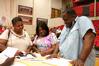 Incoming freshman, Stephanie Nicols from Memphis, Tenn, fills out housing paperwork with her mother Chelcie and her father Stacey during Move In Day. - Photo by Deanna Santangelo