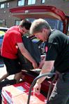 Mark Bolyard, professor of biology and department chair, and Eric Olson, junior engineering major, help a new student unpack her car of Move In Day. - Photo by Deanna Santangelo