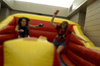 Graduates Meah Harrington and Johnna Green jockey for position at Fall Fest 2003. - Photo by Jonathan Blair